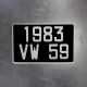 Black old-fashioned aluminum license plate without dash